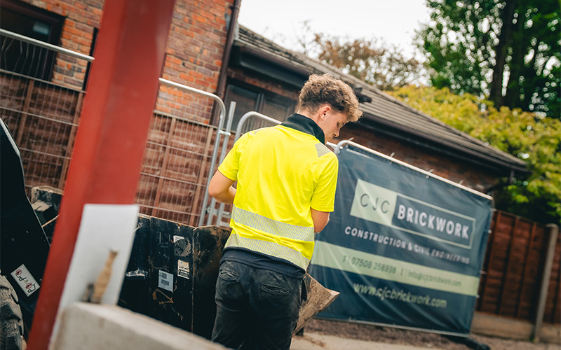 Residential building project showing brickwork and construction work in progress